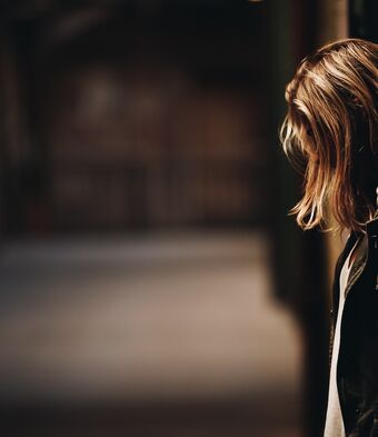 Woman with her head bowed