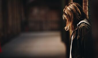 Woman with her head bowed