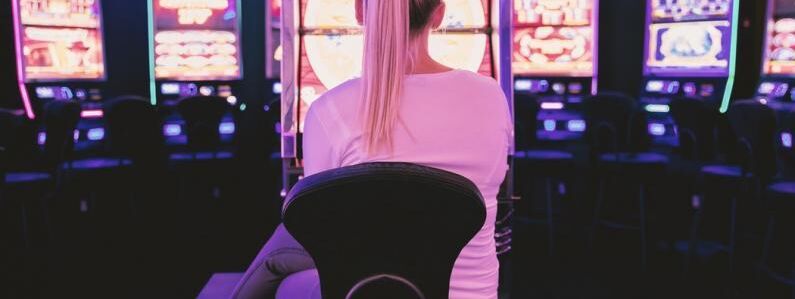 Female sat in front of gambling machines 2 6