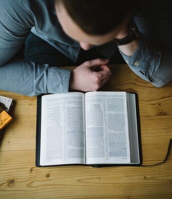 Man with bible alexander michl g8 PF Vtzzk YA unsplash
