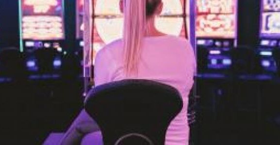 Female sat in front of gambling machines 0 1a