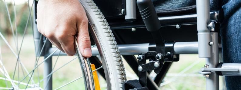 Wheelchair and hand shutterstock 177634730 0