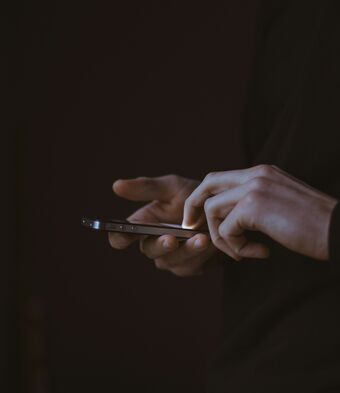 Phone in hand dark