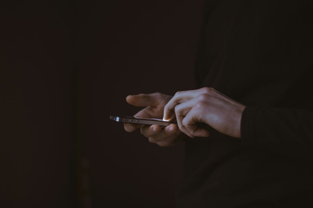 Phone in hand dark