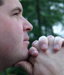 Man praying in woods 2c