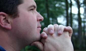 Man praying in woods 2c